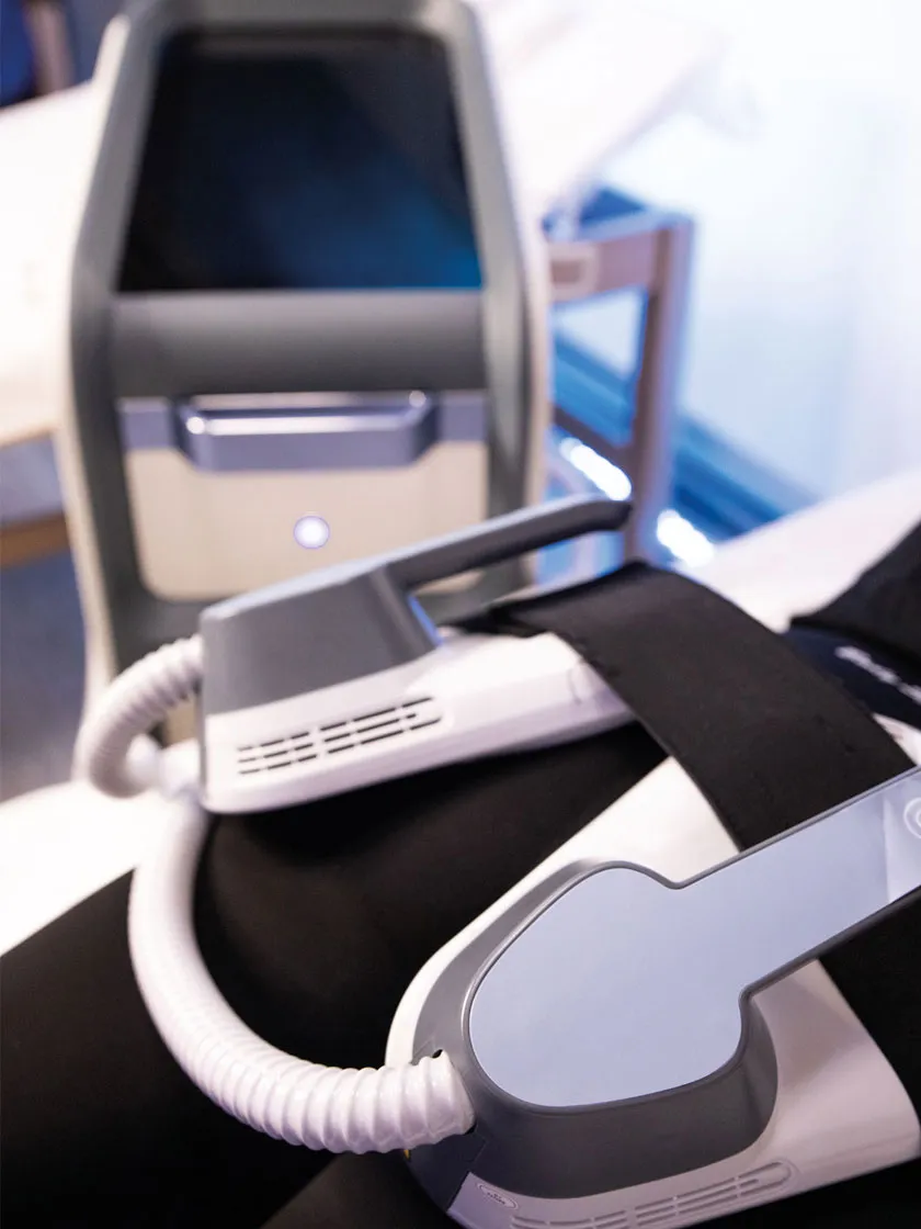 BodySculpt RF applicators secured on a client's abdomen during a non-invasive body contouring session