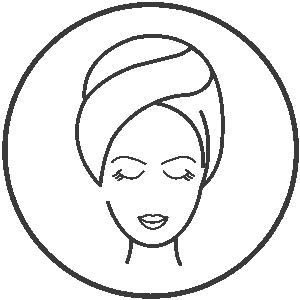 Woman’s face with towel on head and closed eyes – symbol of relaxation and beauty treatment